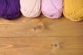 Colorful wool threads for knitting on wooden background Royalty Free Stock Photo