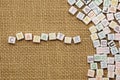 Colorful word character on burlap background