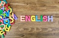 The colorful word `ENGLISH` next to a pile of other letters