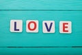 Word love on blue wooden background. Top view. Mock up. Copy space. Valentine mother day. Royalty Free Stock Photo