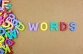 The colorful word WORDS next to a pile of other letters