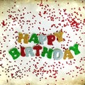 The colorful words HAPPY BIRTHDAY made from multicolored glitter letters on a white background with confetti Royalty Free Stock Photo