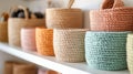 Colorful woven baskets on a white shelf. Royalty Free Stock Photo