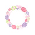 Colorful wreath with Easter eggs isolated on white background