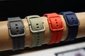 colorful wrist watch straps. Leather silicone strap for electronic watches, on a wooden stand.