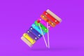 Colorful xylophone with sticks on violet background. Kids toy. Preschool education Royalty Free Stock Photo