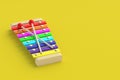 Colorful xylophone on yellow background. Kids toy. Preschool education Royalty Free Stock Photo