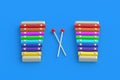 Colorful xylophones and sticks on blue background. Kids toy Royalty Free Stock Photo