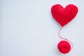 Colorful yarn ball isolated on white background. Space for text. Red heart like a symbol of love. Hobby concept Royalty Free Stock Photo