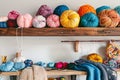 colorful yarn balls on shelf above a knitting station Royalty Free Stock Photo