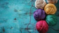 Colorful yarn balls on turquoise textured background Royalty Free Stock Photo
