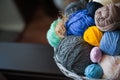 Colorful yarn balls in wicker basket on white Royalty Free Stock Photo