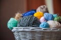 Colorful yarn balls in wicker basket on white Royalty Free Stock Photo