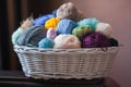 Colorful yarn balls in wicker basket on white Royalty Free Stock Photo