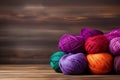 Colorful yarn balls on wooden background, creative copy space for knitting and crafting Royalty Free Stock Photo