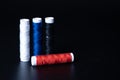 Colorful yarn on spool, yarn on tube, cotton, wool , Color sewing threads on black background. Royalty Free Stock Photo