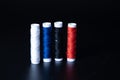 Colorful yarn on spool, yarn on tube, cotton, wool , Color sewing threads on black background. Royalty Free Stock Photo