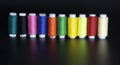 Colorful yarn on spool, yarn on tube, cotton, wool, linen thread, polyester like rain bow