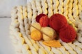Colorful yarns, crochet pattern, hook and festive lights on blanket Royalty Free Stock Photo