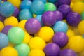 Colorful yellow, blue and green plastic balls. Royalty Free Stock Photo