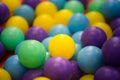 Colorful yellow, blue and green plastic balls. Royalty Free Stock Photo