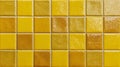 Colorful yellow ceramic tiles background arranged in a grid pattern create a vibrant backdrop for home decor or design projects Royalty Free Stock Photo