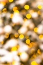 Colorful yellow Christmas Tree Bokeh background of de focused glittering lights. Pattern concept. Festive xmas bokeh defocused Royalty Free Stock Photo