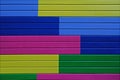 Colorful yellow, green, blue and pink painted wooden wall Royalty Free Stock Photo