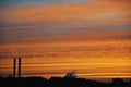 Colorful yellow orange dark dramatic evening sky over industrial Royalty Free Stock Photo