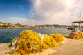 Colorful yellow and orange traditional fishing nets at the pier in Finikas Marina, Greece Royalty Free Stock Photo