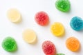 Colorful yellow red orange green gummy jelly candies coated with sugar on white background. Kids birthday party Halloween sweets Royalty Free Stock Photo