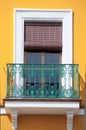 Colorful yellow window and turquoise balcony in Spain Royalty Free Stock Photo