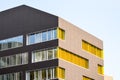 Colorful yellow windows in a modern architecture building. Royalty Free Stock Photo