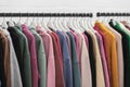 Colorful youth hoodies and cashmere sweaters on a clothes rack