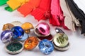 Colorful zippers, pencils and buttons. Royalty Free Stock Photo
