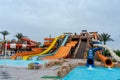 Colorful zone with water slides and pool in aqua park Royalty Free Stock Photo