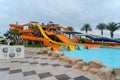 Colorful zone with water slides and pool in aqua park Royalty Free Stock Photo