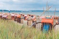 Colorfuled striped roofed chairs on sandy beach in Travemunde., Lubeck, Germany Royalty Free Stock Photo