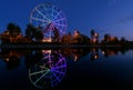 Colorfull abstract Ferris wheel with reflection on the Konny island in Irkutsk city