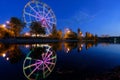 Colorfull abstract Ferris wheel with reflection on the Konny island in Irkutsk city