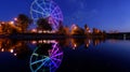 Colorfull abstract Ferris wheel with reflection on the Konny island in Irkutsk city