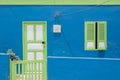 Colorfull faÃÂ§ade with door, window and little fence Royalty Free Stock Photo