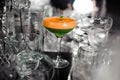 Colorfull green and orange cocktail on black white