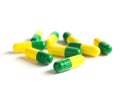 Colorfull green and yellow capsules isolated on white background Royalty Free Stock Photo