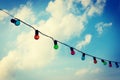 Colorfull lightbulbs against blue sky Royalty Free Stock Photo