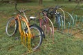 Colorful old bikes in a colorful bike rack Royalty Free Stock Photo