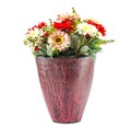 Colorfull plastic flowers in potery jar Royalty Free Stock Photo