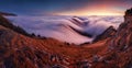 Colorfull sunset behind Mountain peak landscape above clouds - panorama Royalty Free Stock Photo