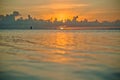 Sunset and siluet of fisherman very far away Royalty Free Stock Photo