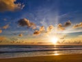 Colorfull tropical beach sunset with yellow, blue sky and sun ray with copy space. sunset over sea at Phuket beach, Thailand Royalty Free Stock Photo